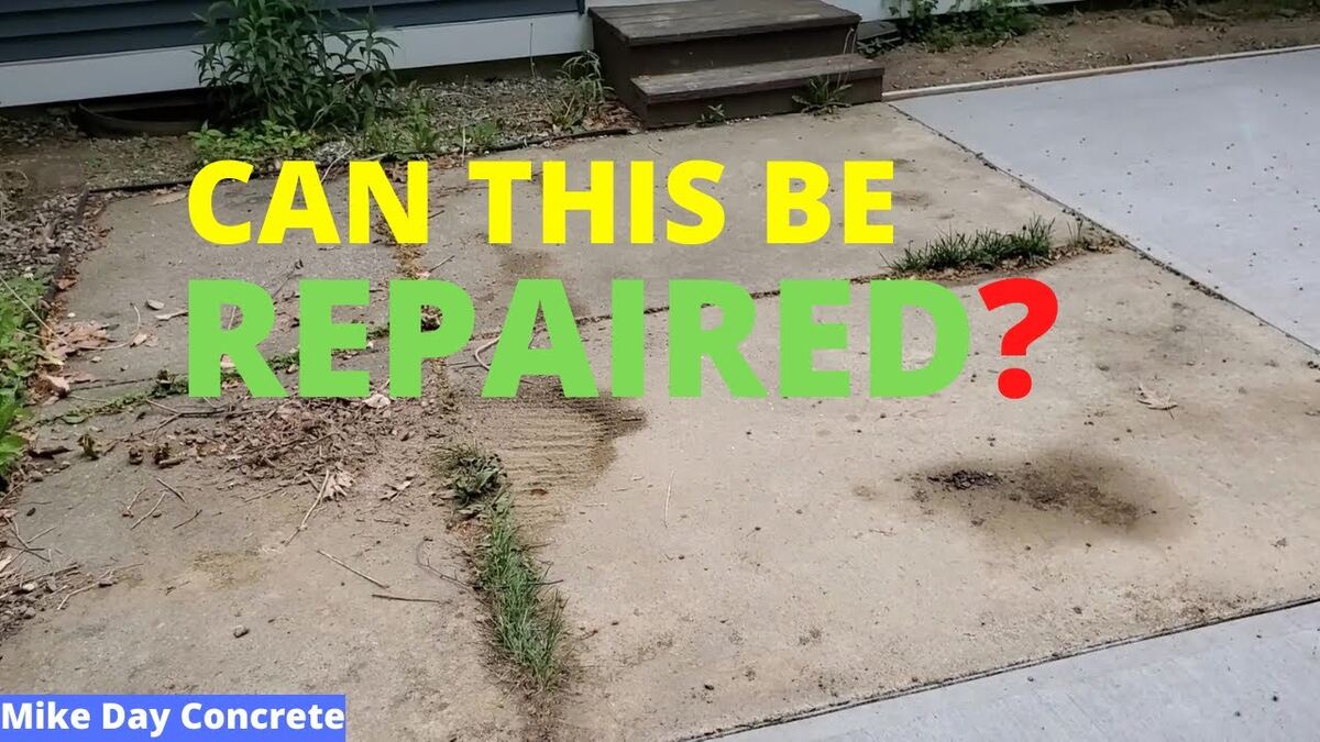 Cracked stained concrete patio before replacement Bluffton SC